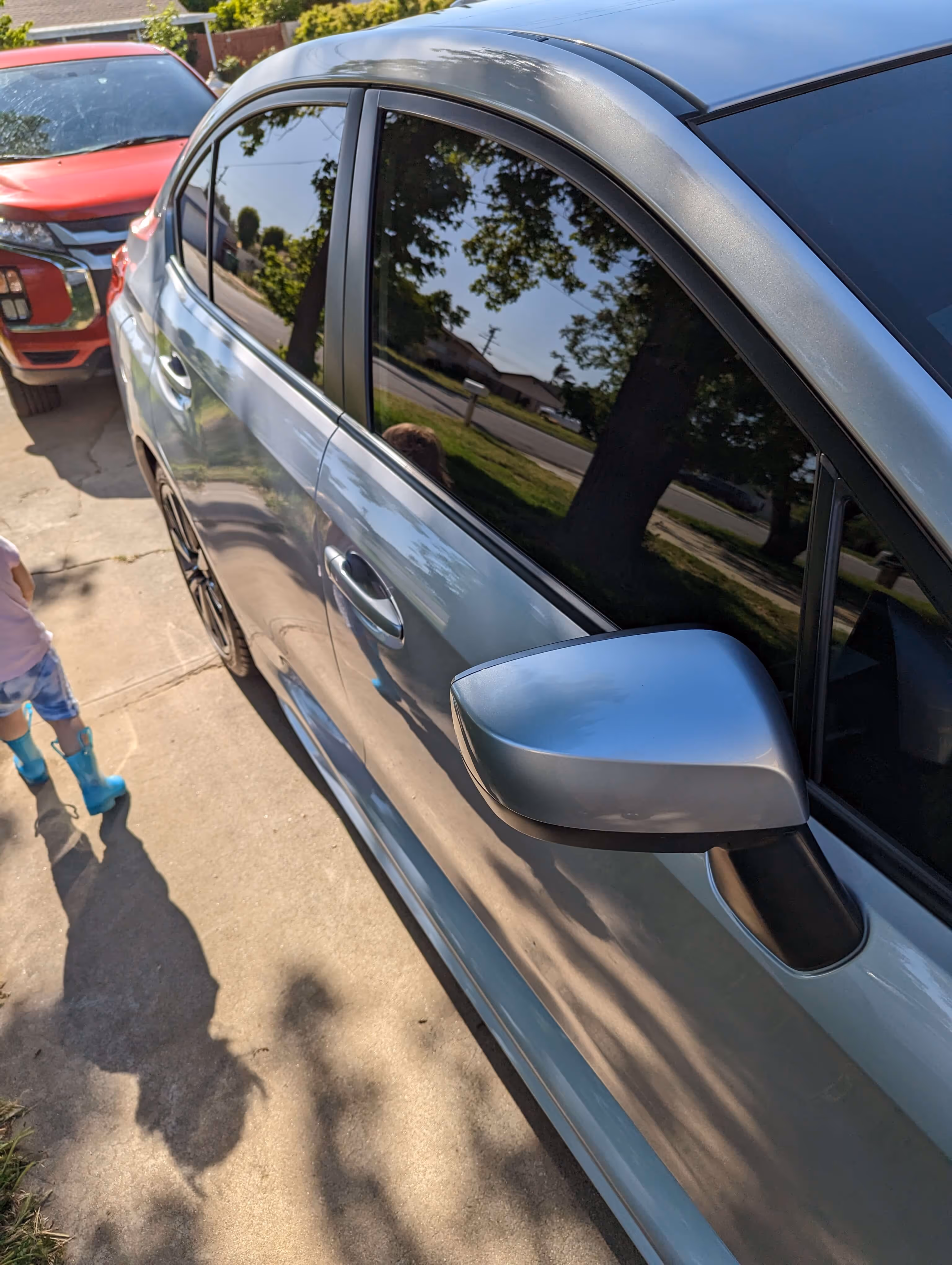 Close-up of ceramic window tint installed on silver SUV side windows